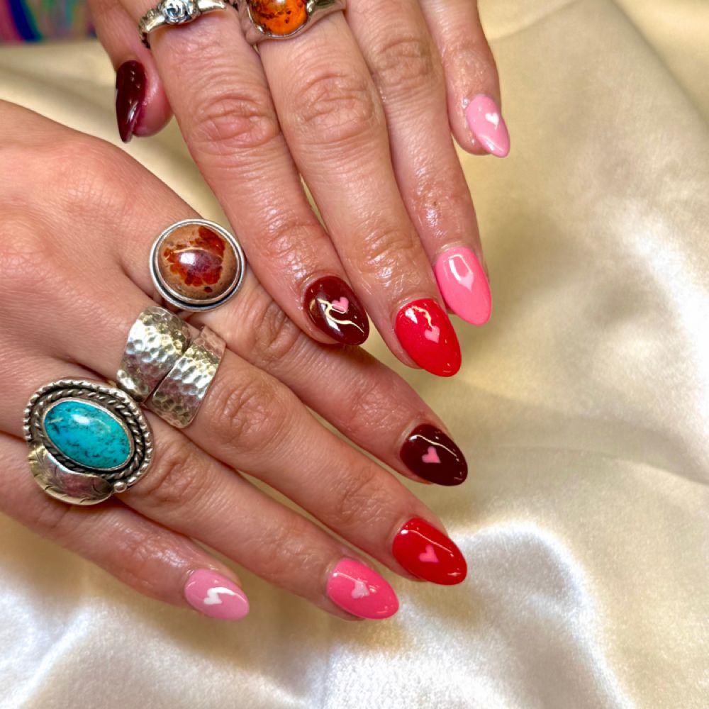 Jewel-tone nail art with rings